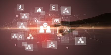 Hand pressing social media multimedia application screen with media icons on futuristic conceptの写真素材