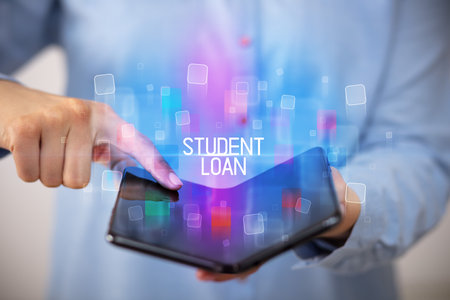 Young man holding a foldable smartphoneの写真素材