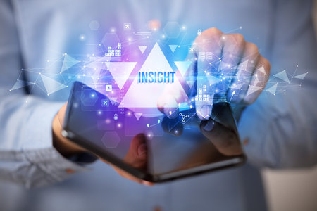 Businessman holding a foldable smartphone, business conceptの写真素材