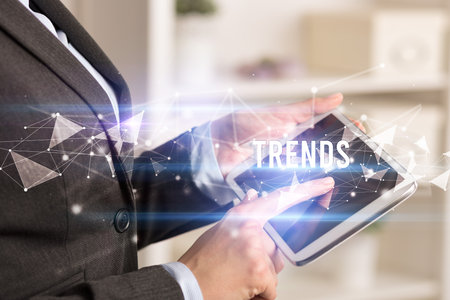 Close up hands using tabletの写真素材