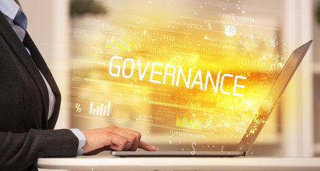 Closeup of businessman hands working on laptopの写真素材