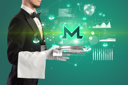 Handsome young waiter in tuxedo holding currency icons on trayの写真素材