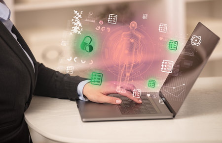 Doctor working on laptop with healthcare conceptの写真素材