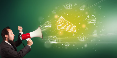 Young person with megaphone and healthy food iconの写真素材