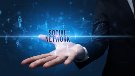 Hand holding social media related inscriptionの写真素材
