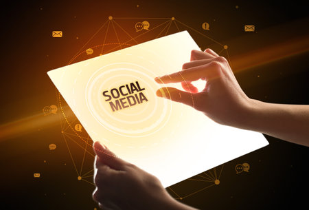 holding futuristic tablet, social media conceptの写真素材