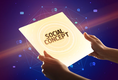 holding futuristic tablet, social media conceptの写真素材