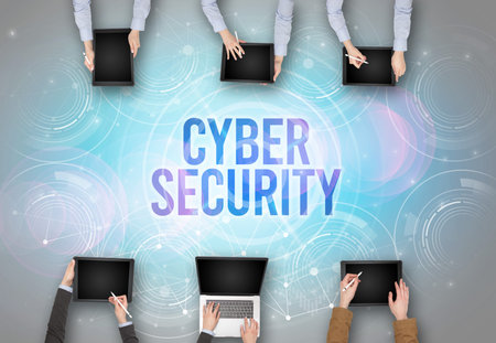 Group of people in front of a laptop, security conceptの写真素材