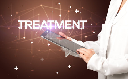 Doctor fills out medical recordの写真素材