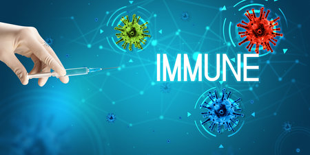 Syringe, medical injection in hand, coronavirus vaccine conceptの写真素材