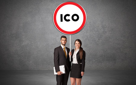 Young business person holdig traffic signの写真素材