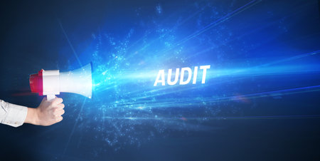 Young person shouting in loudspeakerの写真素材