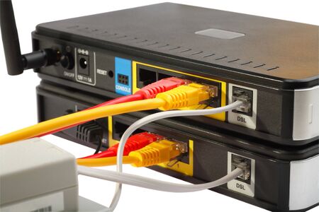 Wireless Routers and Networking Cable. White background.