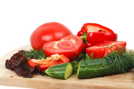 Ingredients for vegetable salad on the board. Isolated on white backgroundの写真素材