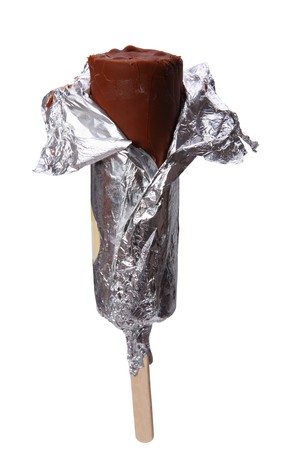 Chocolate ice cream on a stick in foil isolated on a white backgroundの写真素材