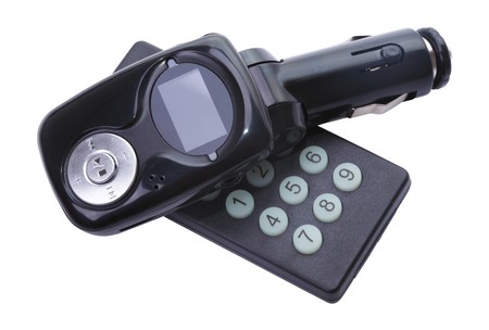 Car FM wireless receiver with remote control. Set in the car's cigarette lighter. Isolated on white backgroundの写真素材