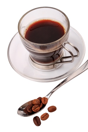 Spoon with coffee beans and a glass cup of coffee isolated on white backgroundの写真素材