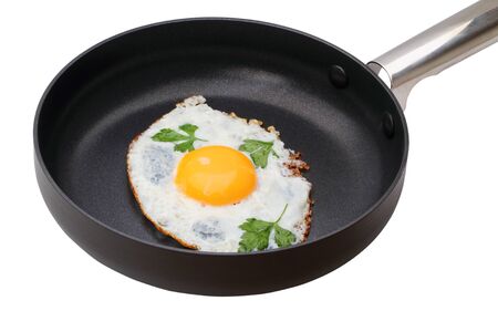 Fried Egg in a frying pan isolated on white backgroundの写真素材
