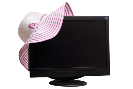 Women's hat and computer monitor isolated on white background. の写真素材