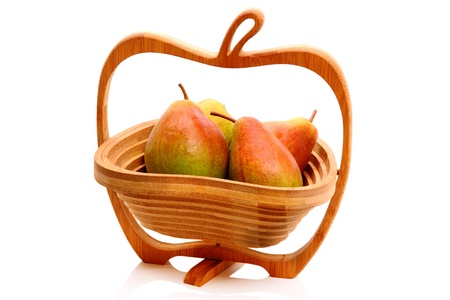 The original wooden vase in the shape of an apple and ripe pears. Isolated on white backgroundの写真素材