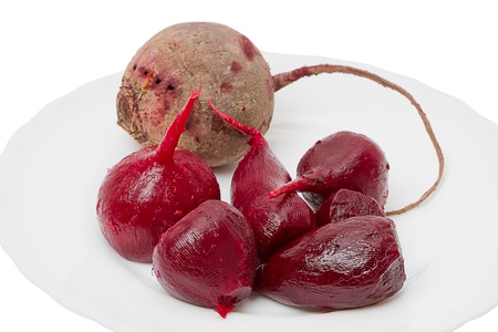 Cooked beetroot on a white plate. Isolated on white backgroundの写真素材