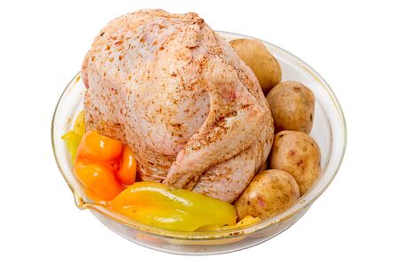 Chicken carcass with vegetables on a white backgroundの写真素材