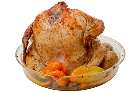 Grilled chicken carcass with vegetables on a white backgroundの写真素材