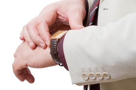 Businessman with a gold watch. Isolated on white backgroundの写真素材