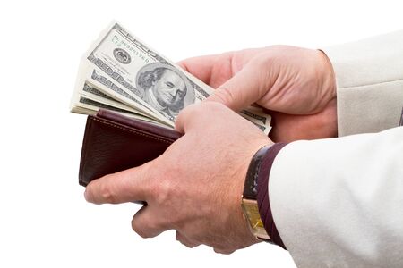 Businessman with leather wallet brown color with dollars. Isolated on white backgroundの写真素材