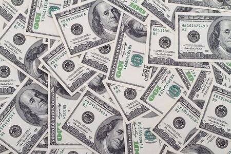 Background of dollars. Numerous bills laid in full frameの写真素材