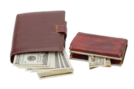 Wallet with a bunch of dollars and an old purse with a dollar. Isolated on white backgroundの写真素材