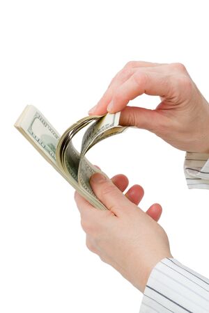 $100 dollar bills counted. Isolated on white backgroundの写真素材