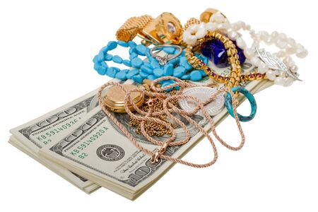 Dollars and jewelry. Isolated on white backgroundの写真素材