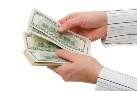 One hundred dollars bills counted. Isolated on white backgroundの写真素材