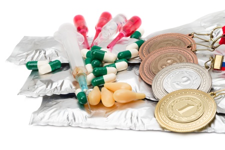 Ampoule, syringes, pills, tablets and sports medals. Isolated on white backgroundの写真素材