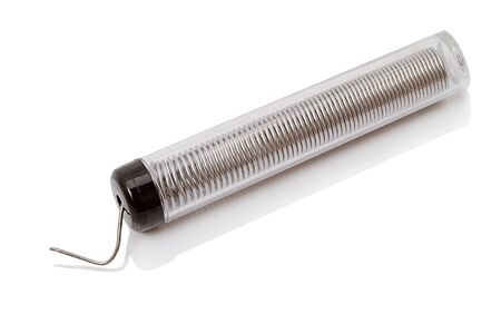 Tin solder isolated on a white background. の写真素材