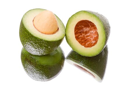 Sliced open avocado isolated on white backgroundの写真素材