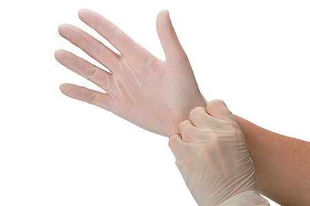 Hands in surgical gloves. Isolated on white backgroundの写真素材