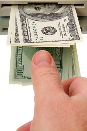 Cash from an ATM and Human Hand. Isolated on white background. の写真素材