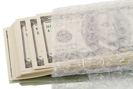 Stack of dollars in a plastic bag. Isolated on white backgroundの写真素材