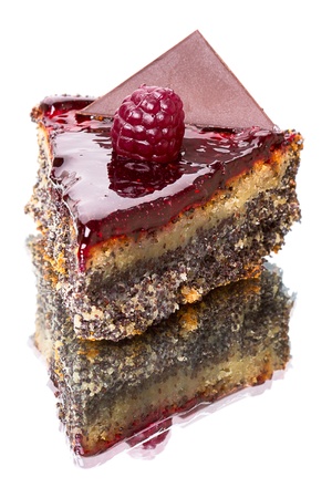 Sliced fruit cake with poppy seeds isolated on a white background.の写真素材