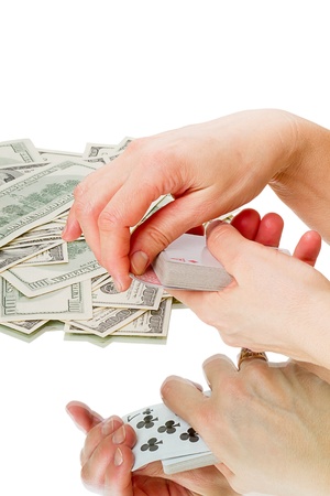 Playing cards and paper us currency. Isolated on white backgroundの写真素材