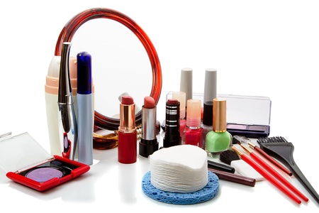 Various cosmetics, mirror, brush on a white backgroundの写真素材