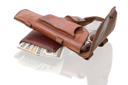 Leather wallet with dollars and holster with a gun. Isolated on white backgroundの写真素材
