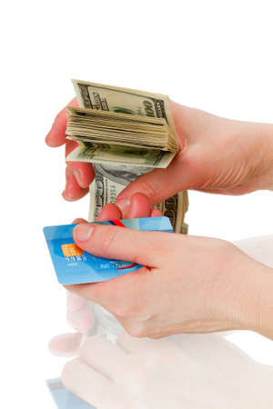 Hands of cash and credit card isolated on white backgroundの写真素材