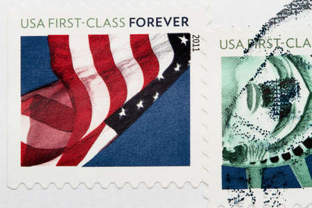 Stamp with United States of America flags. Postmarks stamps on a white envelopeの写真素材