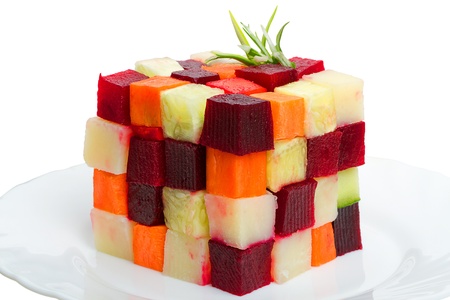 A cube of cubes of vegetables on white plateの写真素材