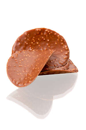 Chocolate chips isolated on white backgroundの写真素材