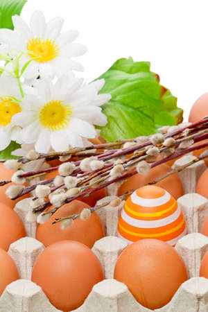 Preparation for Easter  Pussy willow, egg in a nest and plastic flowersの写真素材