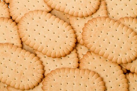 Close-up photos of dry cookies filling the frame.の写真素材